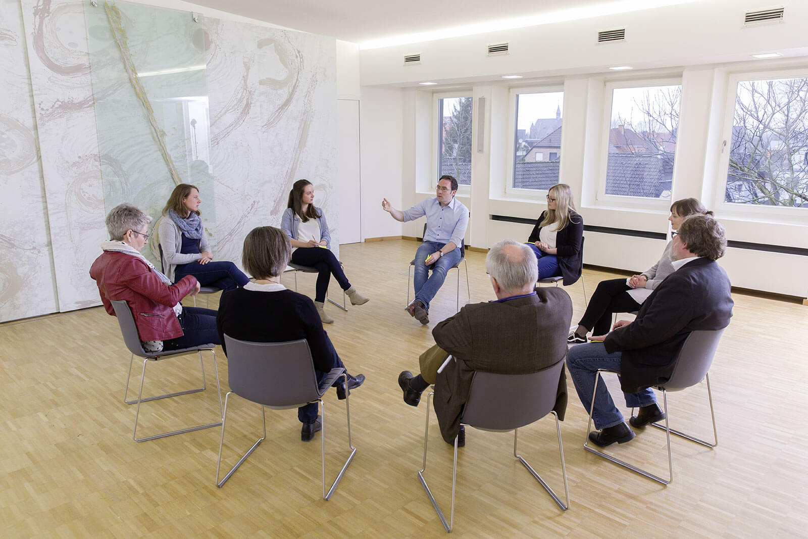 staff sitting in circle of chairs